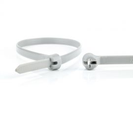 De sluiting van een grijze Ty-Rap® kunststof kabelbinder uitvergroot, naast een uitvergrote kop van een andere kabelbinder.;Een grijze Ty-Rap® kunststof kabelbinder, naast een uitvergrote sluiting van een andere Ty-Rap® kabelbinder.